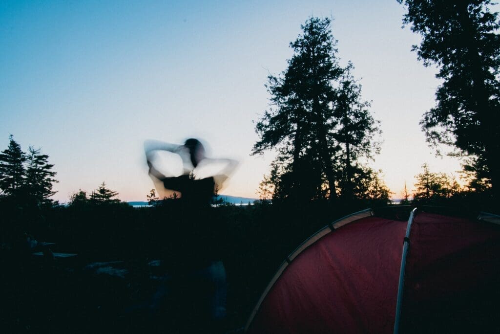 The sun sets in Acadia National Park as Noah takes the world camps in a tent. 