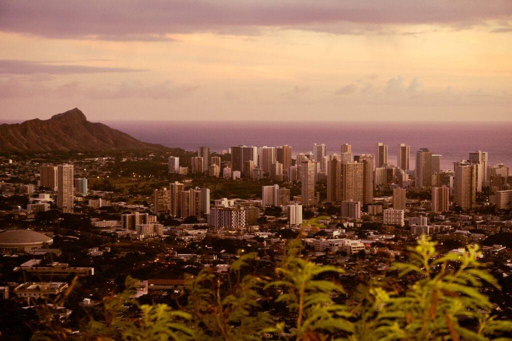 Diamond Head and Waikiki shine during a sunset. 