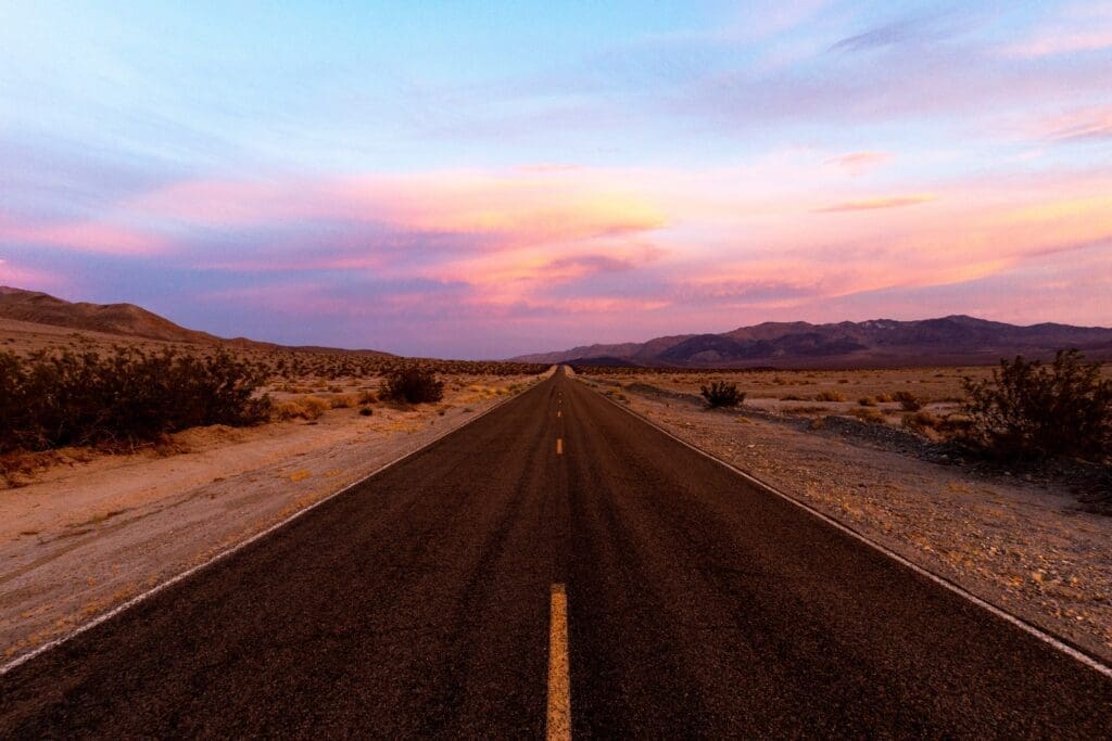 A long empty road in Death Valley National Park.