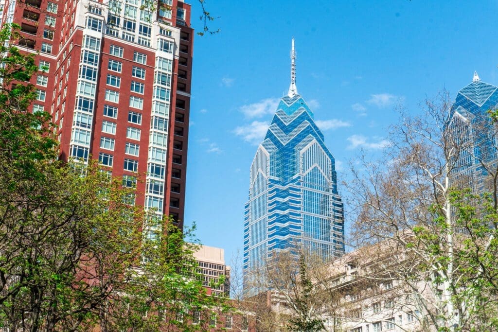 The view of skyscrapers from a park in Philly.