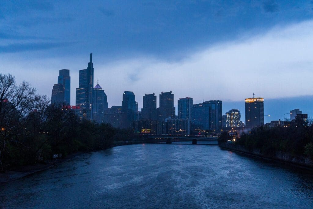 Philly’s skyline lights up at night along the Schuylkill River Trail. Running this trail is a great thing to do alone in Philly