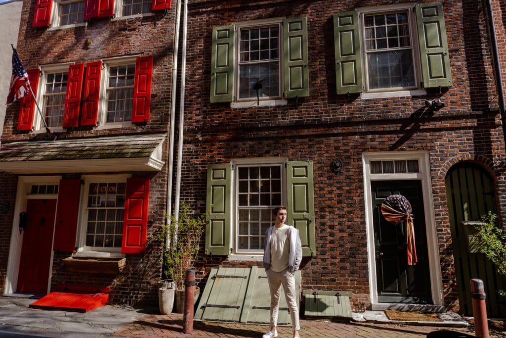 Noah poses in Philly during his solo trip at Elfreth’s Alley