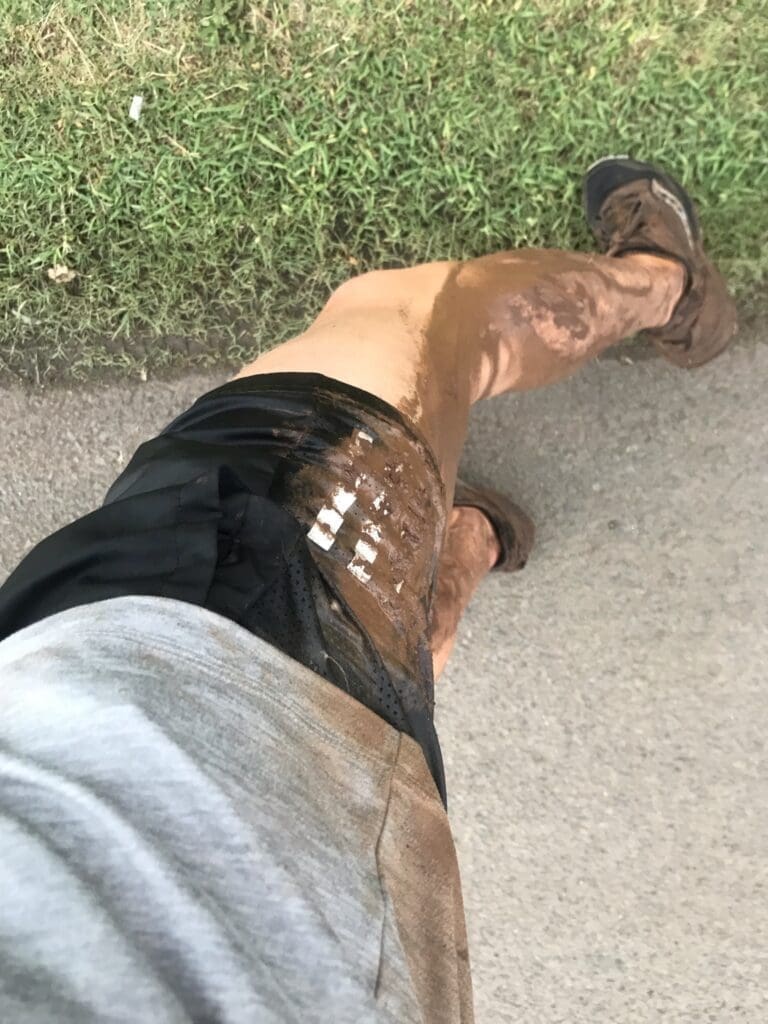 Noah's legs are covered in mud after solo hiking Laie Falls. 