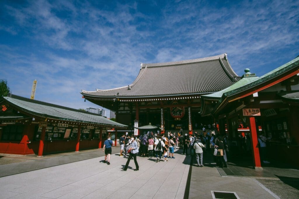Tourist visit a Sensoji Temple during their solo tokyo travel itinerary.