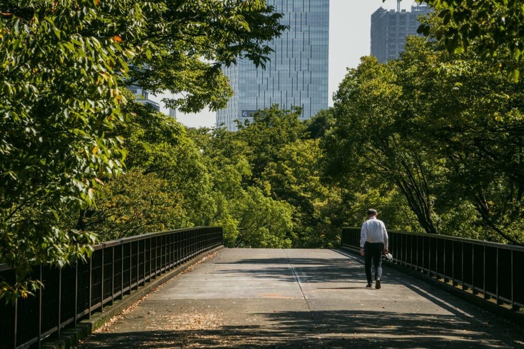 A man walks alone in Yoyogi Park. Visiting this park is one of my favorite things to do alone in Tokyo.