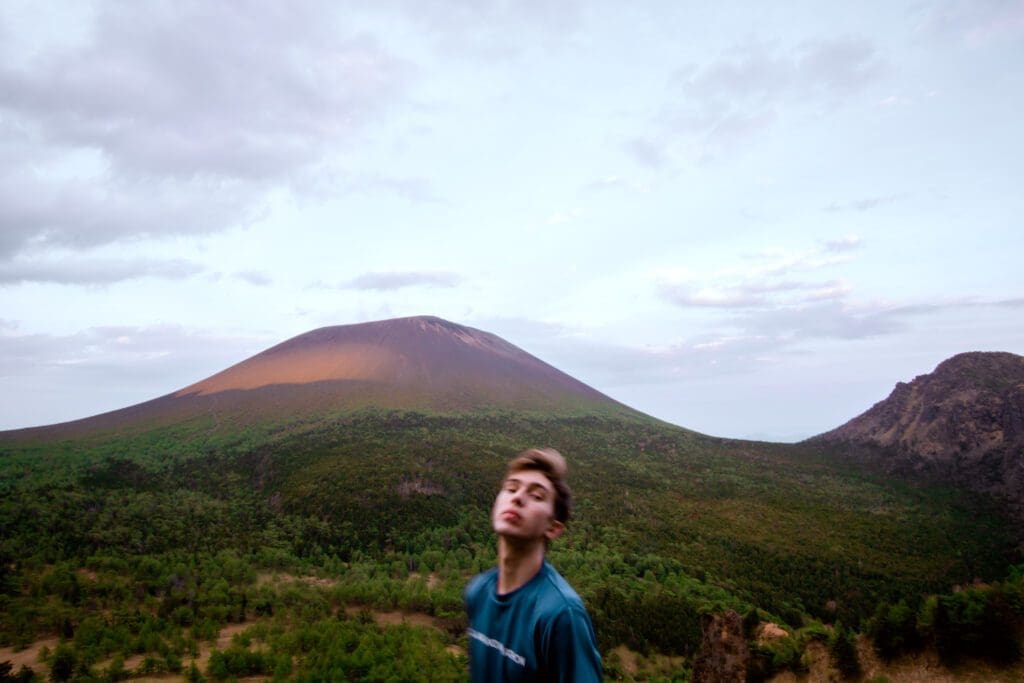 Noah takes the world poses during his solo hike to My Asama. 