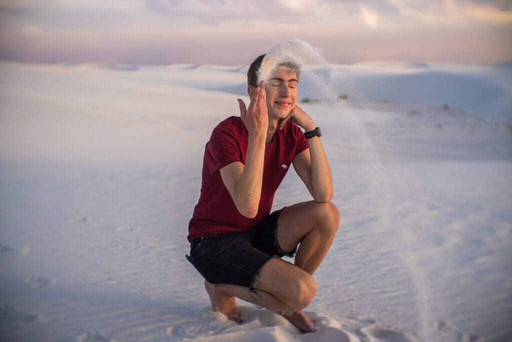 Noah poses during sunset at White Sands National Park. 