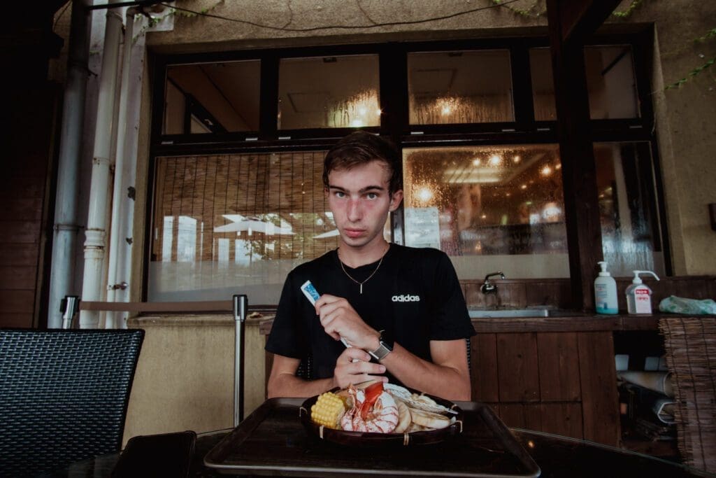 Noah eating seafood in Japan