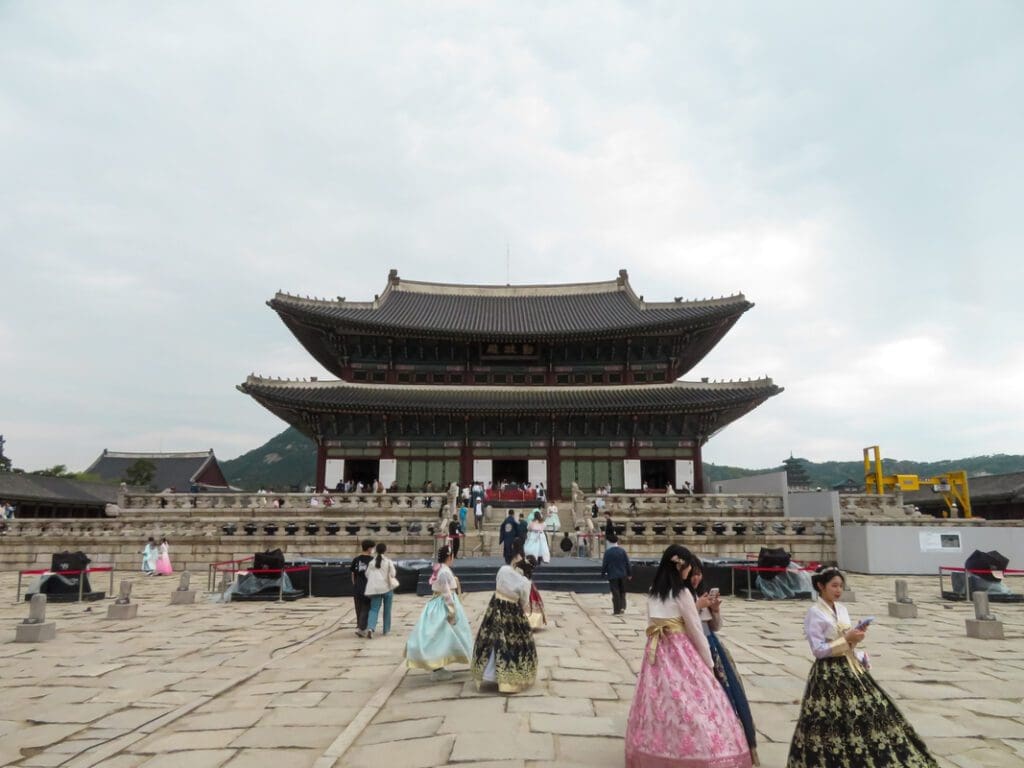 Gyeongbokgung Palace full of tourists in Seoul, South Korea. This is one of the most famous things to do alone in Seoul.