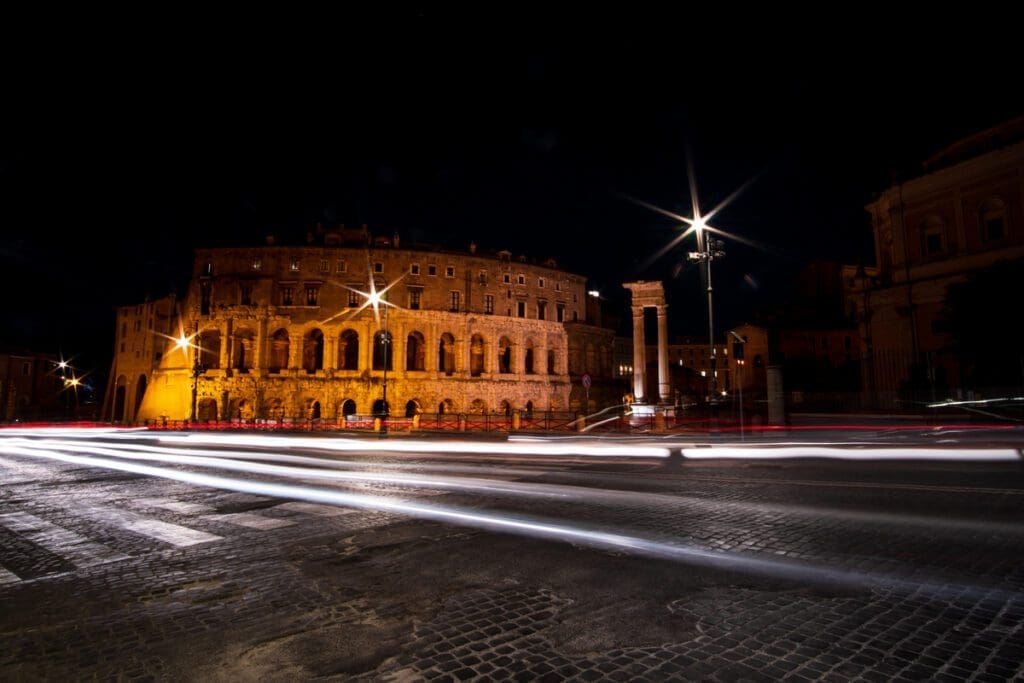 A long exposure of a car passing by Marcellus Theatre in Rome.