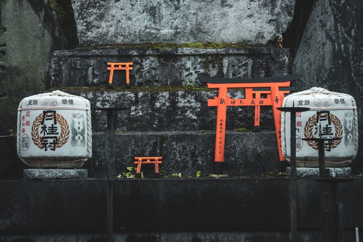 A close-up image of small torii gates placed at a Japanese shrine.