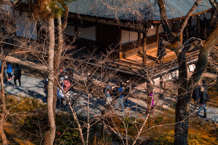 People touring a temple in Kyoto, Japan.