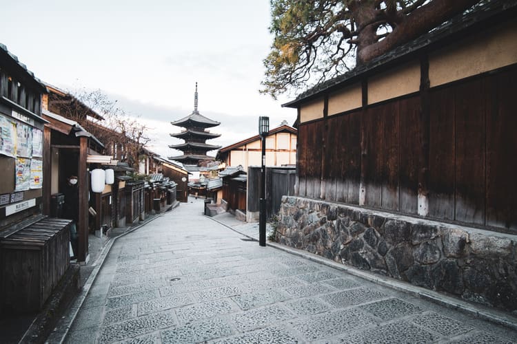 an empty street framing the famous Hokan-ji temple in GIon, Japan